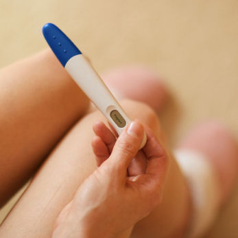 Woman taking pregnancy test