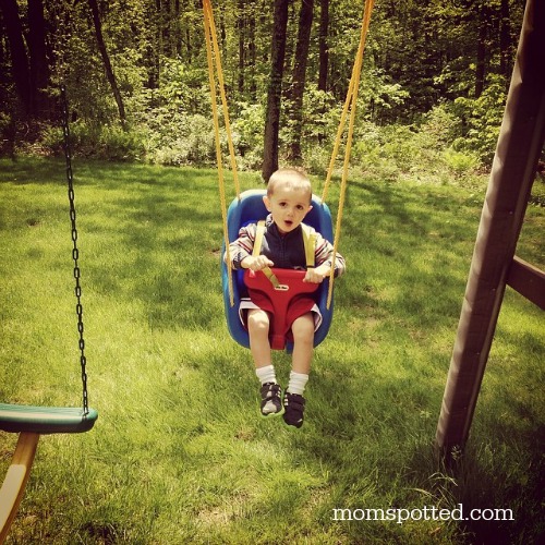 Sawyer swinging in his swing 