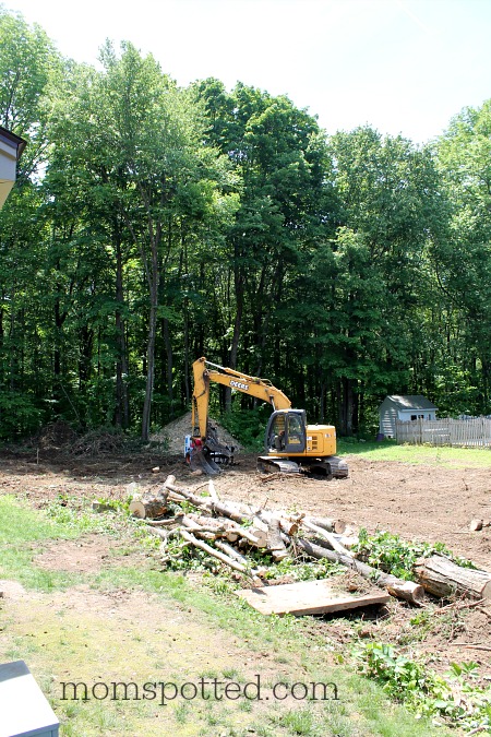 John Deere excavators clearing trees