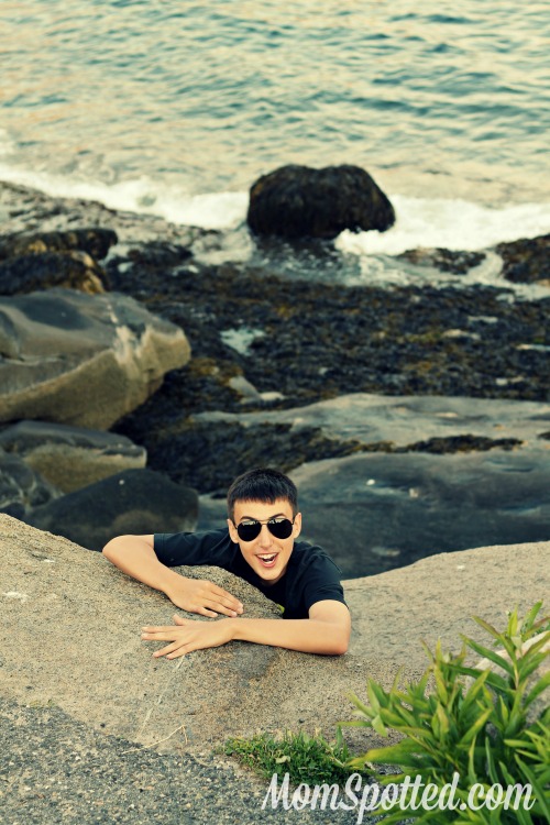 Johnny climbing rocks in maine