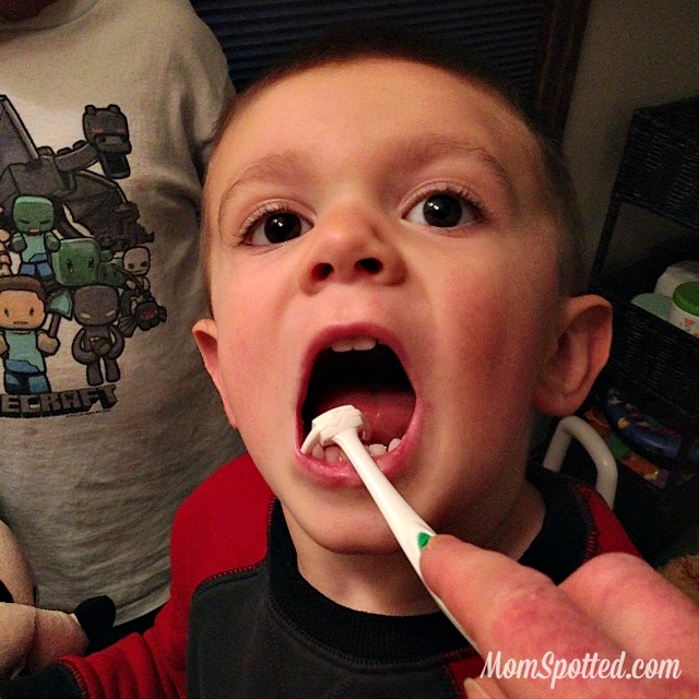 Sawyer James flossing his teeth