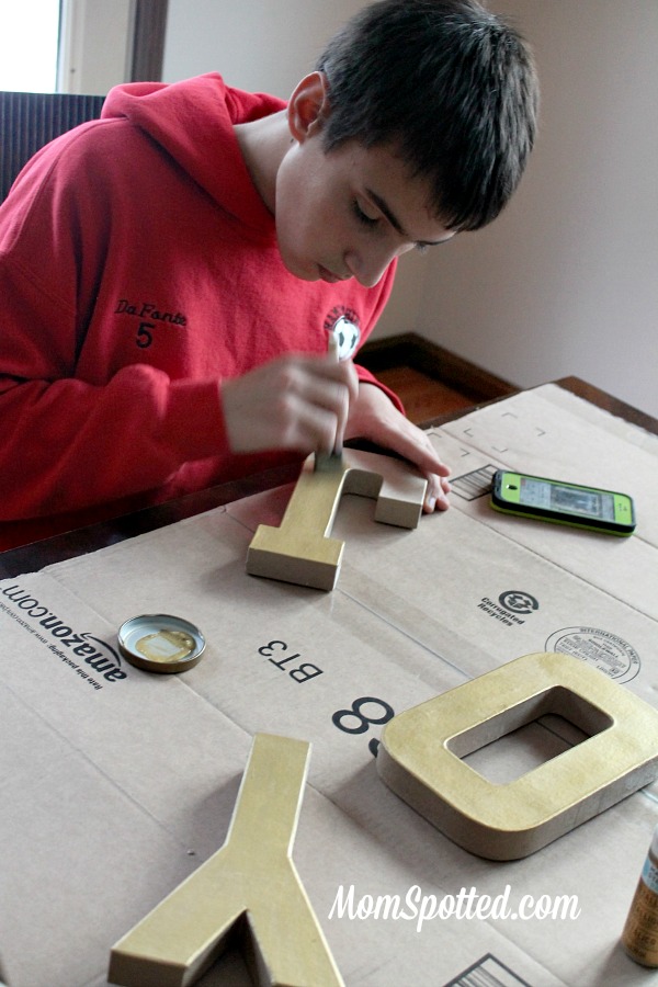 Make Your Own Gold Glittery Christmas Letter Decoration tutorial found on momspotted.com glitter, modge podge, christmas decor