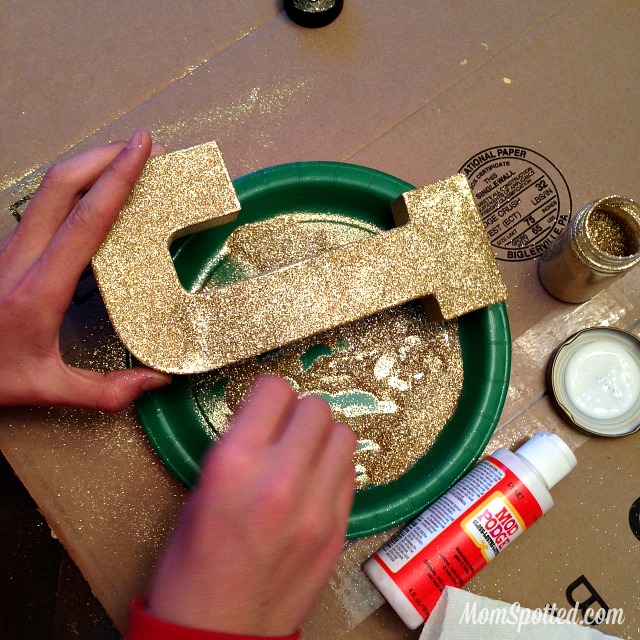 Make Your Own Gold Glittery Christmas Letter Decoration tutorial found on momspotted.com glitter, modge podge, christmas decor