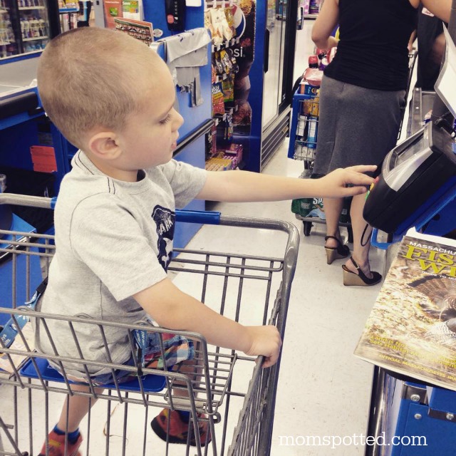 Sawyer paying bill at Walmart