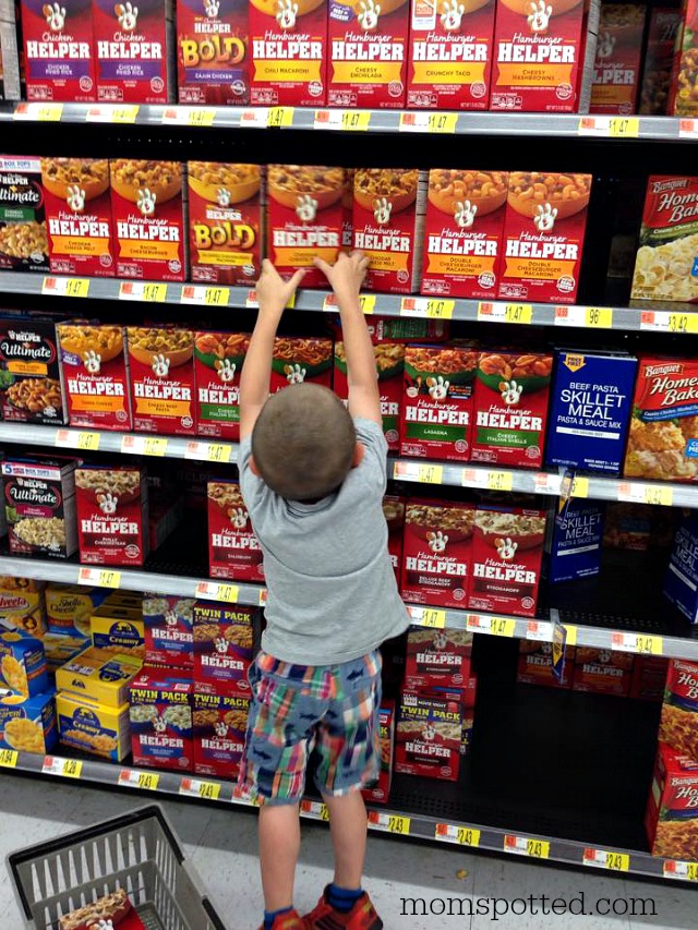 Sawyer picking out Hamburger Helper at Walmart