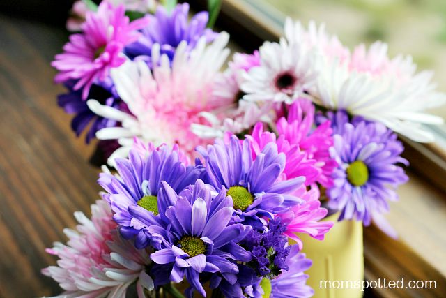 pretty flowers in mason jar vases