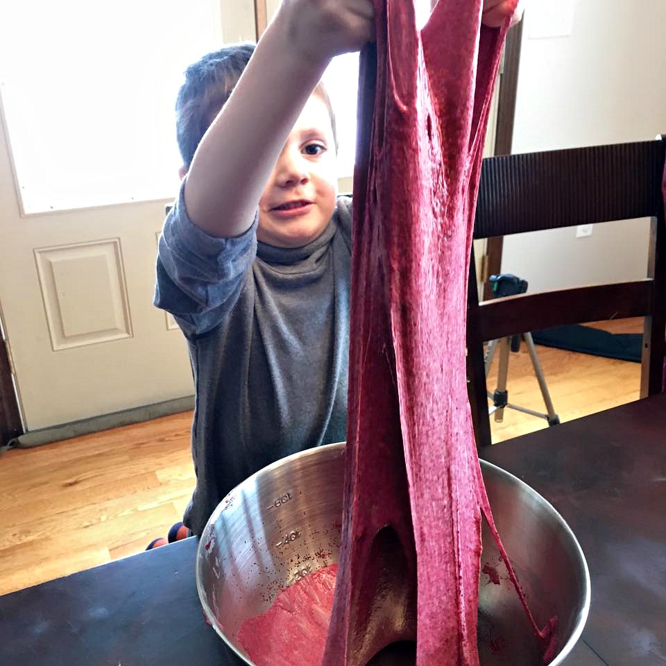 Sawyer stretching his Valentines Day Slime