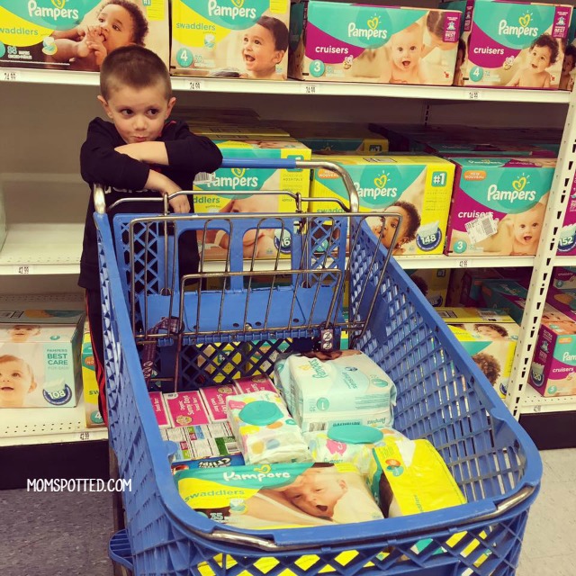 Sawyer shopping for Pampers Diapers at Babies R Us